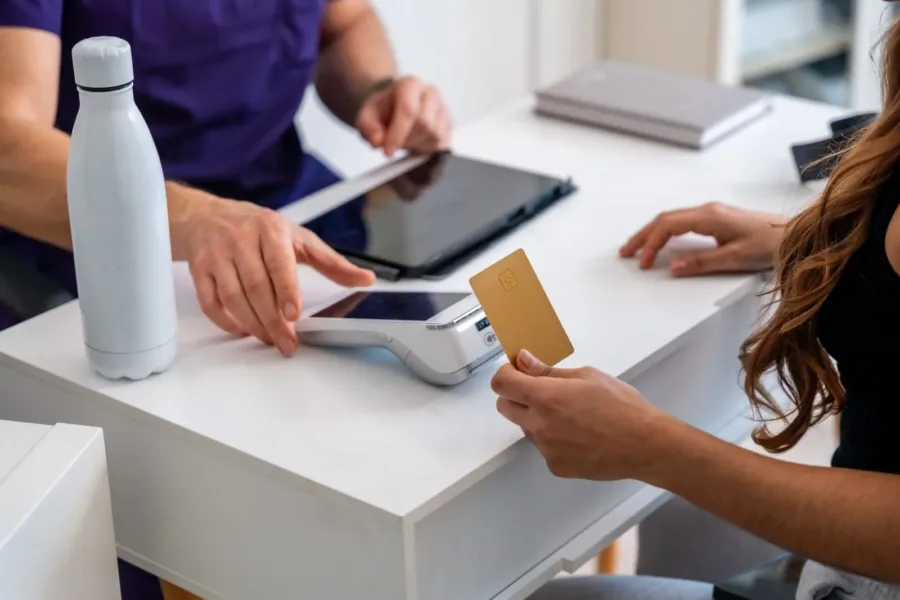 102058162 patient paying for medical physiotherapy treatment using credit card